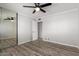 A well-lit bedroom is complete with modern floors and a sliding door mirror at 8345 E Oak St, Scottsdale, AZ 85257