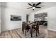 Cozy dining room flows seamlessly into the living room and boasts stylish decor and natural light at 8345 E Oak St, Scottsdale, AZ 85257
