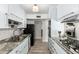 Updated kitchen with granite countertops, stainless steel appliances, and a gas stovetop for easy meal prep at 8345 E Oak St, Scottsdale, AZ 85257