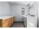 This practical laundry room is designed with storage and a dryer at 8345 E Oak St, Scottsdale, AZ 85257
