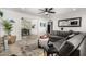 Open-concept living room featuring a gray sofa, stylish decor, and easy access to the dining area at 8345 E Oak St, Scottsdale, AZ 85257