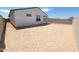 Spacious backyard enclosed by a block fence featuring bare land and ready for personalization at 8530 W Trenton Ct, Florence, AZ 85132
