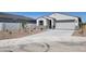 Attractive single-story home featuring a two-car garage and low-maintenance landscaping at 8530 W Trenton Ct, Florence, AZ 85132