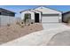 Charming single-story home with desert landscaping and a two-car garage at 8530 W Trenton Ct, Florence, AZ 85132