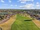 Overhead shot of the golf course featuring well-maintained greens, sand traps, and beautiful landscaping at 8530 W Trenton Ct, Florence, AZ 85132