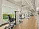 An array of weight machines sit alongside a wall of windows in this fitness center with lots of sunlight at 8530 W Trenton Ct, Florence, AZ 85132