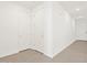 Bright hallway featuring hardwood floors and white paneled doors at 8530 W Trenton Ct, Florence, AZ 85132