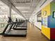 A line of treadmills are perfectly aligned in a row in this bright and airy workout facility at 8530 W Trenton Ct, Florence, AZ 85132
