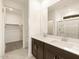 Bathroom with double sinks, walk-in closet, and shower, provides ample space at 8576 W Trenton Ct, Florence, AZ 85132