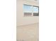 Well-lit bedroom with large window and neutral tile flooring at 8576 W Trenton Ct, Florence, AZ 85132