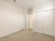 Bright bedroom with closet, plush carpeting and a fresh coat of neutral paint at 8576 W Trenton Ct, Florence, AZ 85132