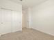 Bright bedroom with closet, plush carpeting and a fresh coat of neutral paint at 8576 W Trenton Ct, Florence, AZ 85132