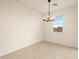 Bright dining room featuring a modern chandelier and window with natural light at 8576 W Trenton Ct, Florence, AZ 85132