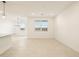An inviting living space with dining area showcasing neutral tones and tile flooring at 8576 W Trenton Ct, Florence, AZ 85132