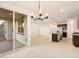 Open floorplan with large sliding doors, island and stainless steel appliances at 8576 W Trenton Ct, Florence, AZ 85132