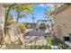 An inviting backyard retreat featuring a hammock, a pergola, and decorative landscaping for relaxation and entertaining at 9231 E Carmel Ave, Mesa, AZ 85208