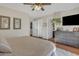 Comfortable bedroom offering natural light, closet access, and a built-in dresser at 9231 E Carmel Ave, Mesa, AZ 85208