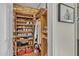 Organized walk-in closet with custom wood shelving and shoe racks at 9231 E Carmel Ave, Mesa, AZ 85208
