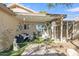 Covered patio with seating, hammock, and a cat enclosure at 9231 E Carmel Ave, Mesa, AZ 85208