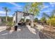 Outdoor patio with a pergola, draped curtains, and dining set at 9231 E Carmel Ave, Mesa, AZ 85208