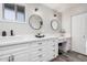 Primary bath with double vanity, makeup table and plenty of cabinet storage at 1002 W Fairway Dr, Mesa, AZ 85201
