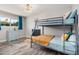 Cozy ' bedroom with bunk beds, plenty of light, and wood-look floors at 1002 W Fairway Dr, Mesa, AZ 85201