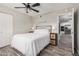 Comfortable bedroom features stylish decor and a view into the kitchen at 1002 W Fairway Dr, Mesa, AZ 85201