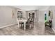 Dining room featuring stylish floors, modern decor, a white wood table and a hutch at 1002 W Fairway Dr, Mesa, AZ 85201