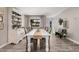 Bright dining room featuring stylish floors, white table with light blue chairs and modern decor at 1002 W Fairway Dr, Mesa, AZ 85201