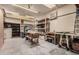 Spacious garage featuring a workbench and ample storage shelving at 1002 W Fairway Dr, Mesa, AZ 85201