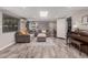 Cozy Living Room with wood floors, comfortable sofa, recessed lights and a skylight at 1002 W Fairway Dr, Mesa, AZ 85201