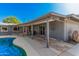 Inviting pool area with covered patio, perfect for outdoor relaxation and entertaining in the shade at 1002 W Fairway Dr, Mesa, AZ 85201