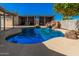 Backyard pool with a charming waterfall feature and two cabanas at 1002 W Fairway Dr, Mesa, AZ 85201