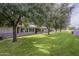 Expansive backyard featuring mature trees and well-maintained landscaping at 10417 W Deanne Dr, Sun City, AZ 85351