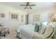 Comfortable bedroom with a ceiling fan and natural light at 10417 W Deanne Dr, Sun City, AZ 85351