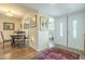 Open dining area with classic decor, leading to a bright, modern kitchen at 10417 W Deanne Dr, Sun City, AZ 85351