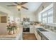 Bright kitchen featuring custom cabinets, stainless steel appliances, and wood flooring at 10417 W Deanne Dr, Sun City, AZ 85351