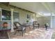 Charming covered patio area with decorative columns and comfortable seating arrangement at 10417 W Deanne Dr, Sun City, AZ 85351