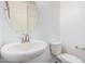 Stylish half-bathroom featuring a modern sink, faucet, and toilet in a neutral color palette at 11611 W Green Dr, Youngtown, AZ 85363