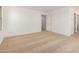Large bedroom with neutral carpet, a walk in closet, and bright white walls at 11611 W Green Dr, Youngtown, AZ 85363