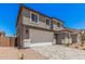 Charming two-story home featuring a two-car garage, a well-maintained yard, and a neutral color scheme at 11611 W Green Dr, Youngtown, AZ 85363