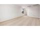 Spacious room features neutral carpeting, a window, and leads to other rooms in the home at 11611 W Green Dr, Youngtown, AZ 85363