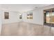Bright, open living room with large windows and sliding glass doors, and tile flooring at 11611 W Green Dr, Youngtown, AZ 85363