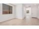 Bright room with neutral walls, tile flooring, and view to other areas of the house at 11611 W Green Dr, Youngtown, AZ 85363
