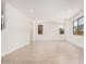 Expansive living area with tile flooring, large windows, and ample natural light at 11611 W Green Dr, Youngtown, AZ 85363