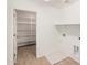 Walk-in pantry features ample shelving for storing food and supplies in an organized manner at 11611 W Green Dr, Youngtown, AZ 85363