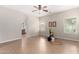 Spacious bedroom with tile floors, large windows, and a neutral color palette at 1414 W Alder Rd, Queen Creek, AZ 85140