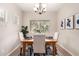 Cozy dining area with modern lighting, comfortable seating, and natural light at 1414 W Alder Rd, Queen Creek, AZ 85140