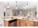 Kitchen showcasing modern appliances, ample counter space, and wood cabinetry at 1414 W Alder Rd, Queen Creek, AZ 85140