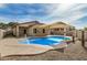 Beautiful backyard pool with sunshade for outdoor fun at 1414 W Alder Rd, Queen Creek, AZ 85140